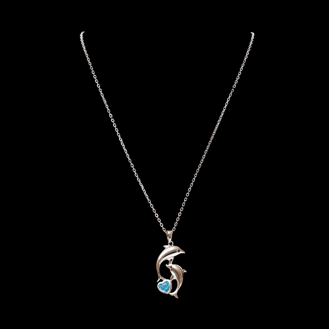 rhodium over sterling silver parent and child dolphin with blue spinel pendant necklace